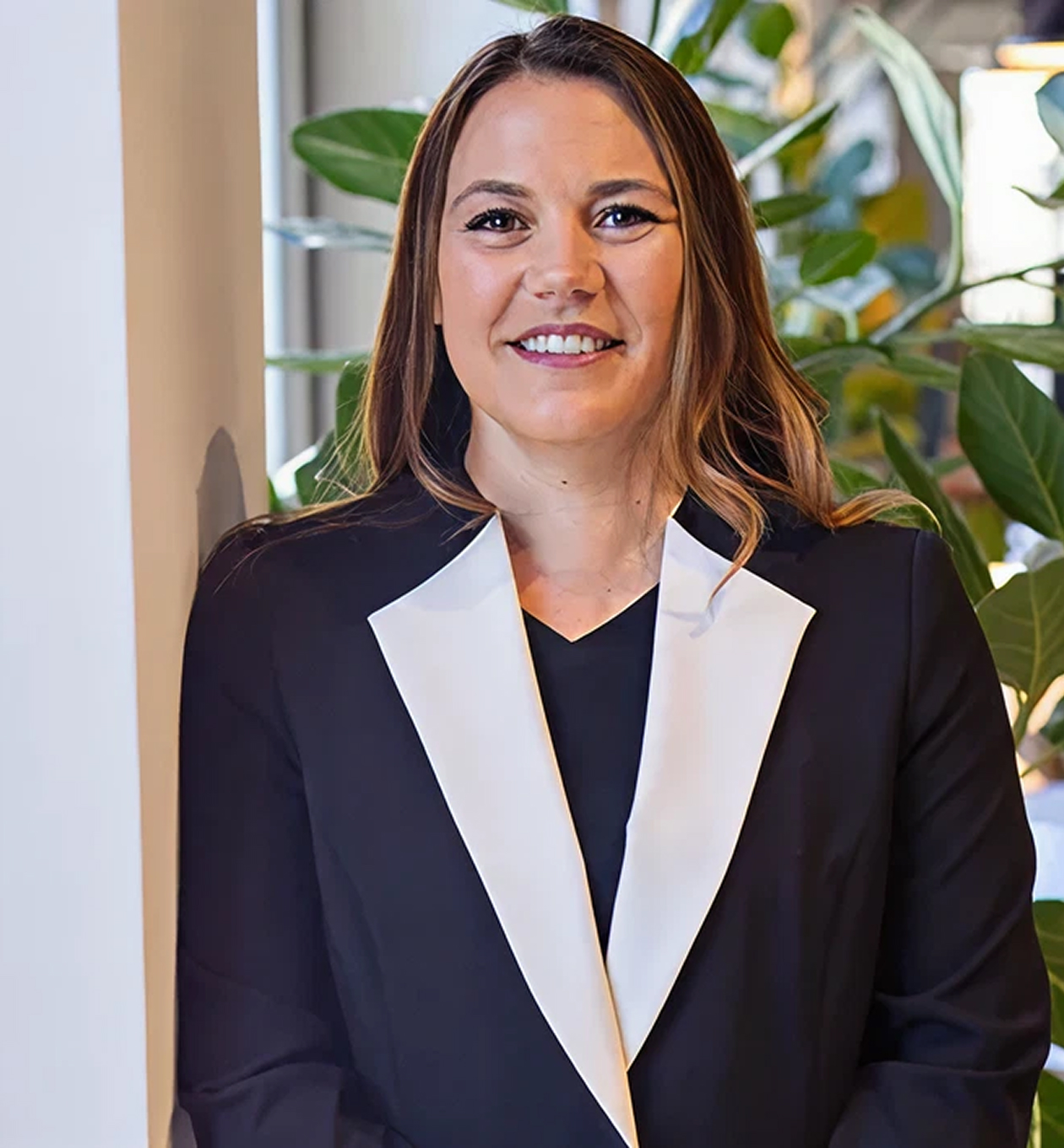 Jennifer L. Martinez attorney portrait smiling in professional attire